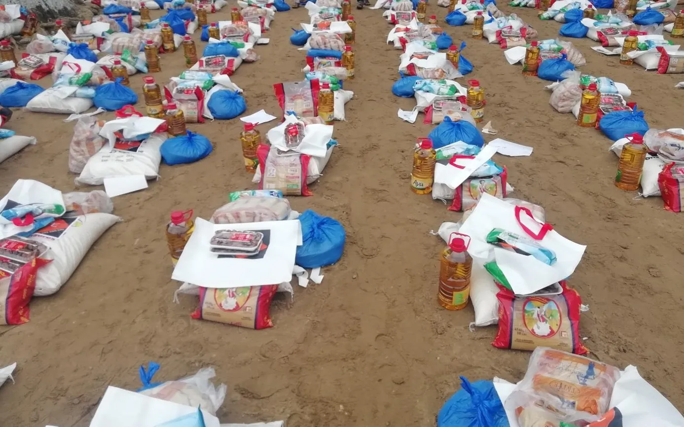 Hundreds of food parcels lined up before distribution