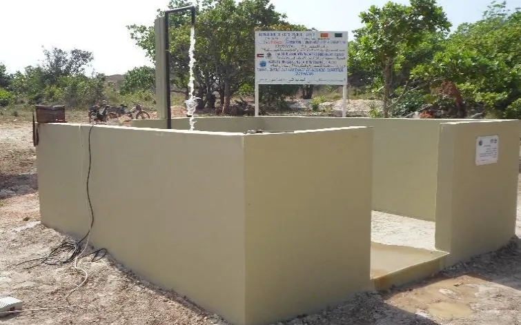 A finished fountain basin with its project sign