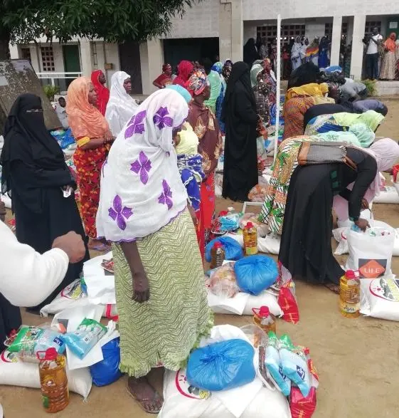 Women receive their parcels