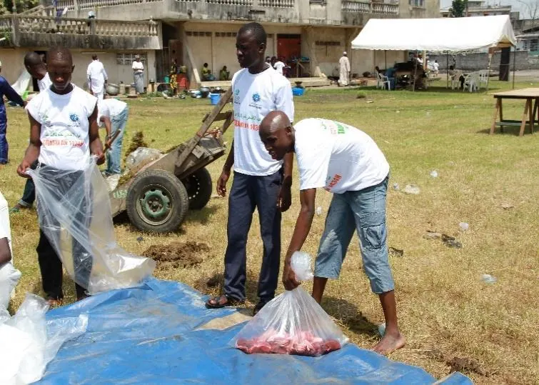 Volunteers prepare the bags of meat